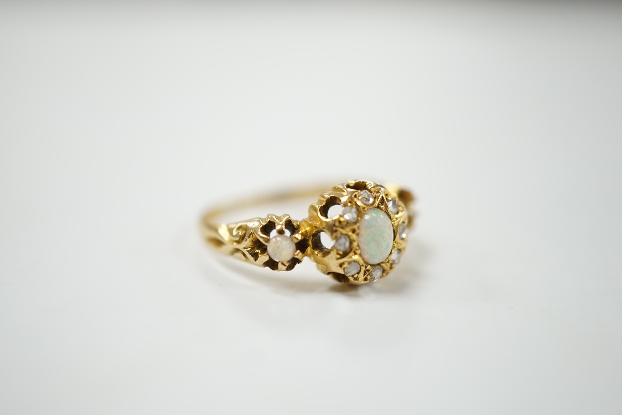 A late Victorian 18ct gold, white opal and diamond cluster set ring, size J, gross weight 2.3 grams. Condition - poor